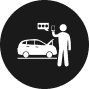 Icon of a person using a smartphone beside a car with an open hood. Speech bubbles above the phone suggest assistance or troubleshooting. Set against a black circular background, this image evokes how an insurance company might streamline roadside support with just a tap.